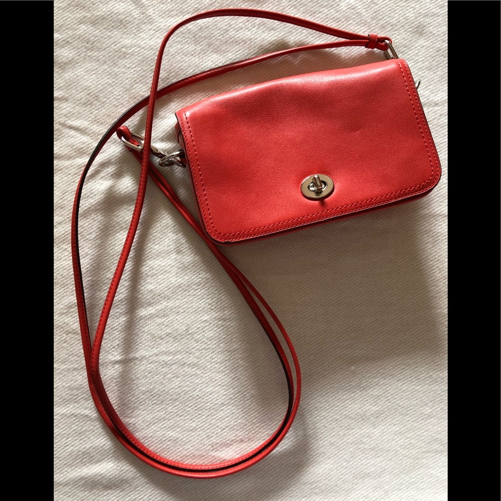 red-orange Coach crossbody bag